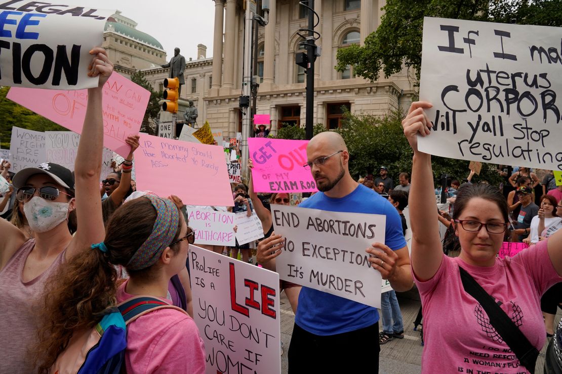 Activists protest outside the Indiana Statehouse during a special session debating on banning abortion in Indianapolis, Indiana, July 25, 2022. In September, a state judge blocked an Indiana law banning abortion at all stages of pregnancy with limited exceptions from being enforced.
