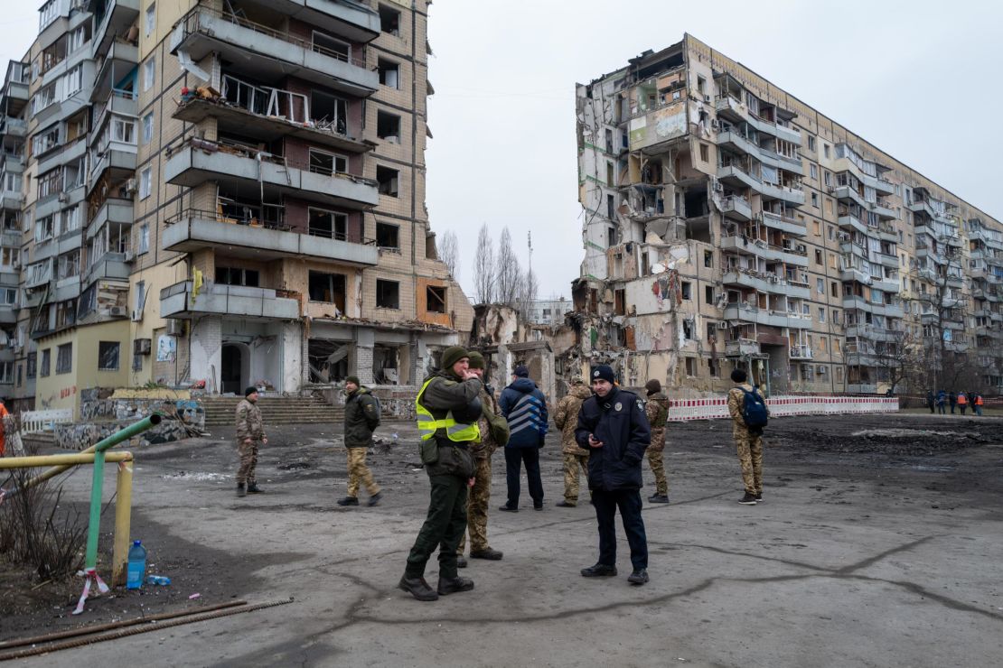 As the search and rescue operation at a destroyed apartment building in Dnipro officially ends, military and police continue to gather at the site where some 45 people, including five children, were killed on Saturday. 