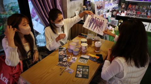 Japanese fans of K-pop group BTS at a cafe featuring BTS goods in Seoul, South Korea, on June 15, 2022. 