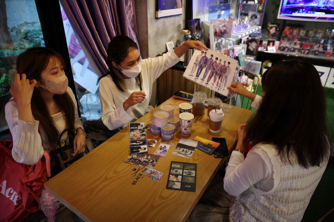 Japanese fans of K-pop group BTS at a cafe featuring BTS goods in Seoul, South Korea, on June 15, 2022. 