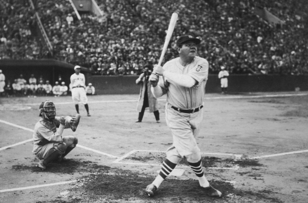 American baseball player Babe Ruth hits a home run during his tour of Japan at the Meiji Jingu Stadium in Tokyo, in 1934.