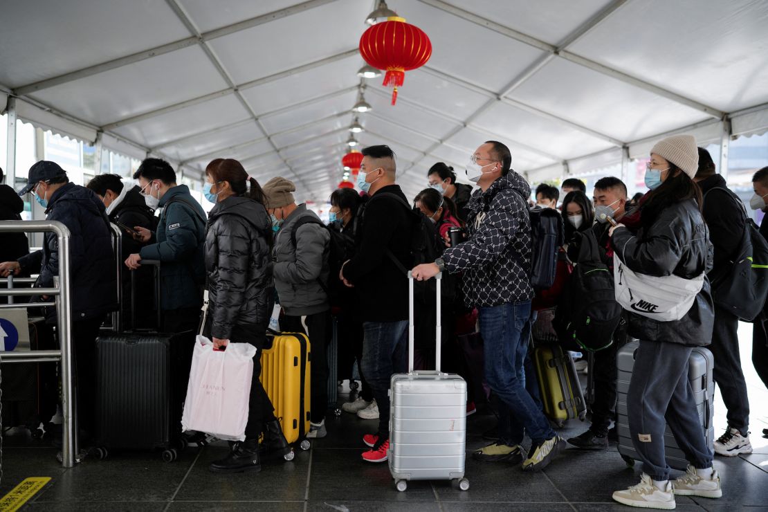 Passengers at a Shanghai railway station during the travel rush ahead of Lunar New Year, January 16, 2023. 