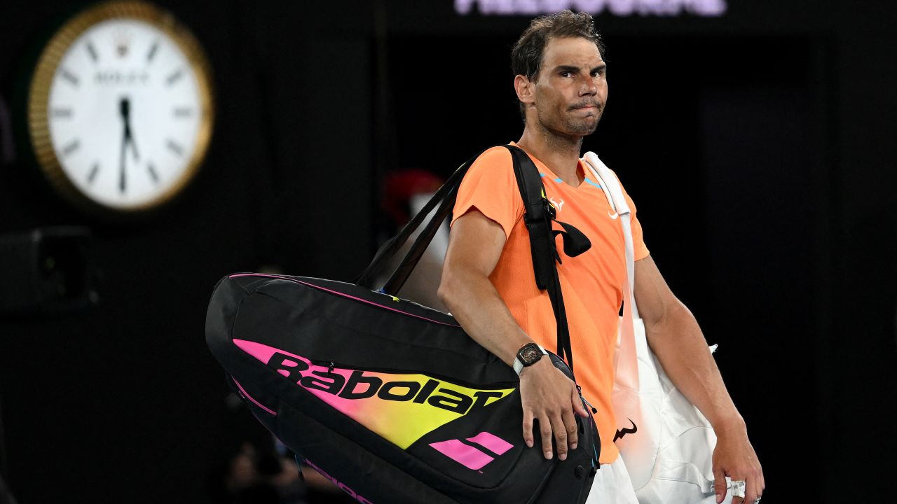 Rafael Nadal leaves the court after losing to Mackenzie McDonald in the Australian Open.