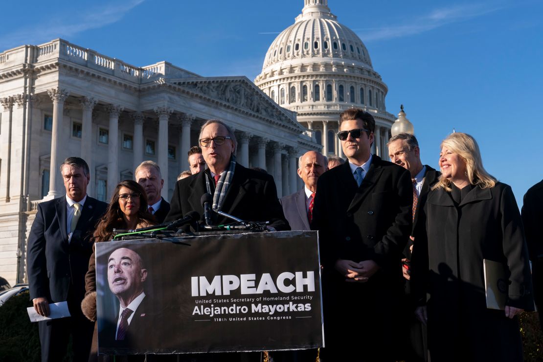 Rep. Andy Biggs, a member of the conservative House Freedom Caucus, speaks with a group of Republican lawmakers calling for the impeachment Secretary of Homeland Security Alejandro Mayorkas. He is joined in the front row by, from left, Rep. Lauren Boebert, Rep. Matt Gaetz, and Rep. Debbie Lesko.
