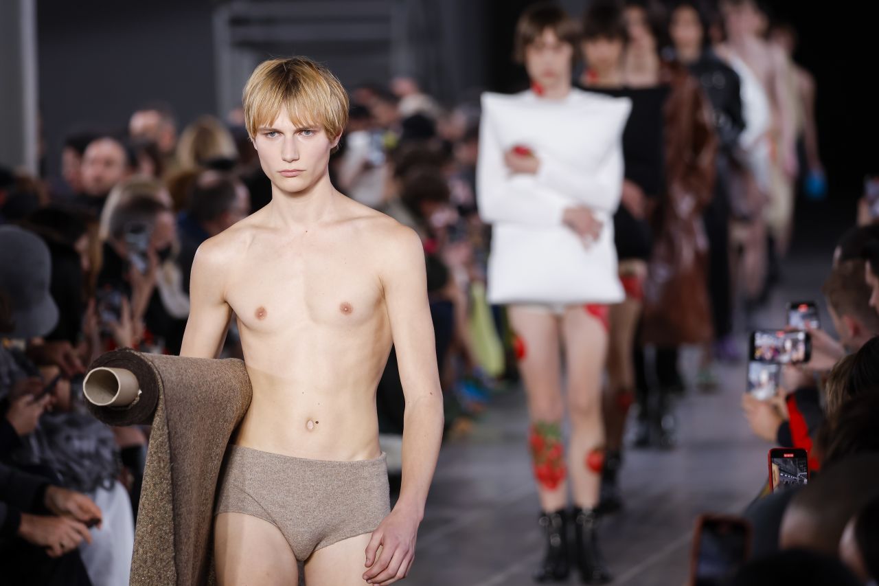 JW Anderson's menswear show in Milan was stripped back to basics. One look even involved a roll of fabric.