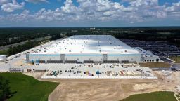 In this aerial view from a drone, construction on an Amazon fulfillment center along Interstate 4 nears completion on August 4, 2020 in Deltona, Florida, USA. The 1.4 million-square-foot warehouse, from which large items will be shipped, is slated to open in November 2020, eventually bringing with it 500 full time jobs. This is Amazon's fifth fulfillment center in Florida, joining existing centers in Miami, Tampa, Orlando and Jacksonville.