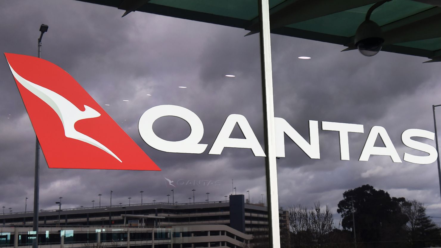 A Qantas logo adorns the side of the Qantas terminal at Melbourne Airport on August 20, 2020. 