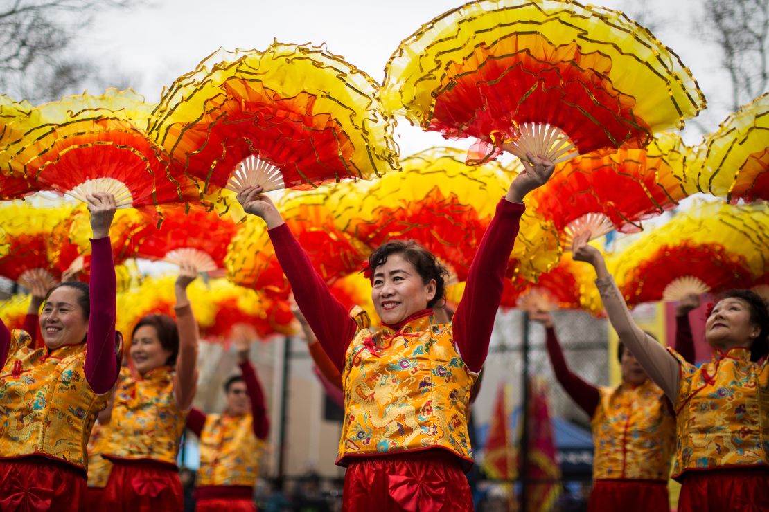 Dancers perform on the first day of the Lunar New Year in New York's Chinatown on February 16, 2018.