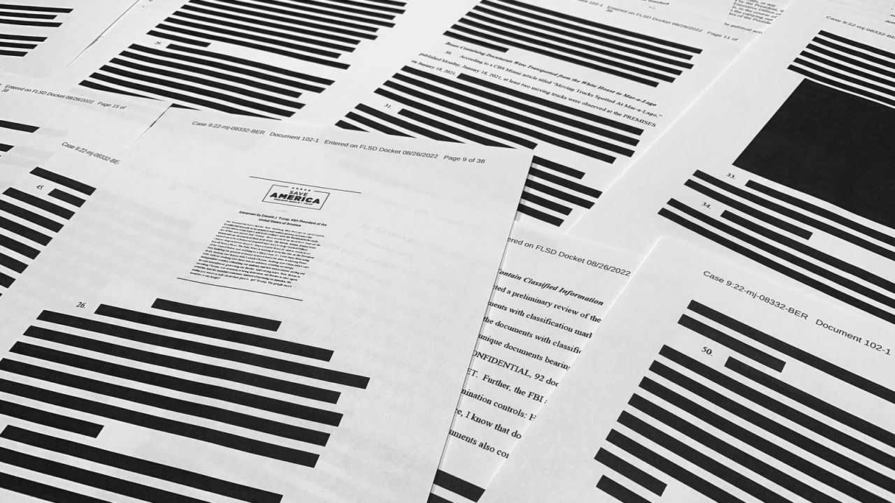Pages from the affidavit by the FBI in support of obtaining a search warrant for former President Donald Trump's Mar-a-Lago estate are photographed Friday, Aug. 26, 2022. U.S. Magistrate Judge Bruce Reinhart ordered the Justice Department to make public a redacted version of the affidavit it relied on when federal agents searched Trump's estate to look for classified documents. (AP Photo/Jon Elswick)