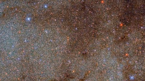 This image, filled with stars and dust clouds, is a tiny extract of the full Dark Energy Camera Plane Survey of the Milky Way. 