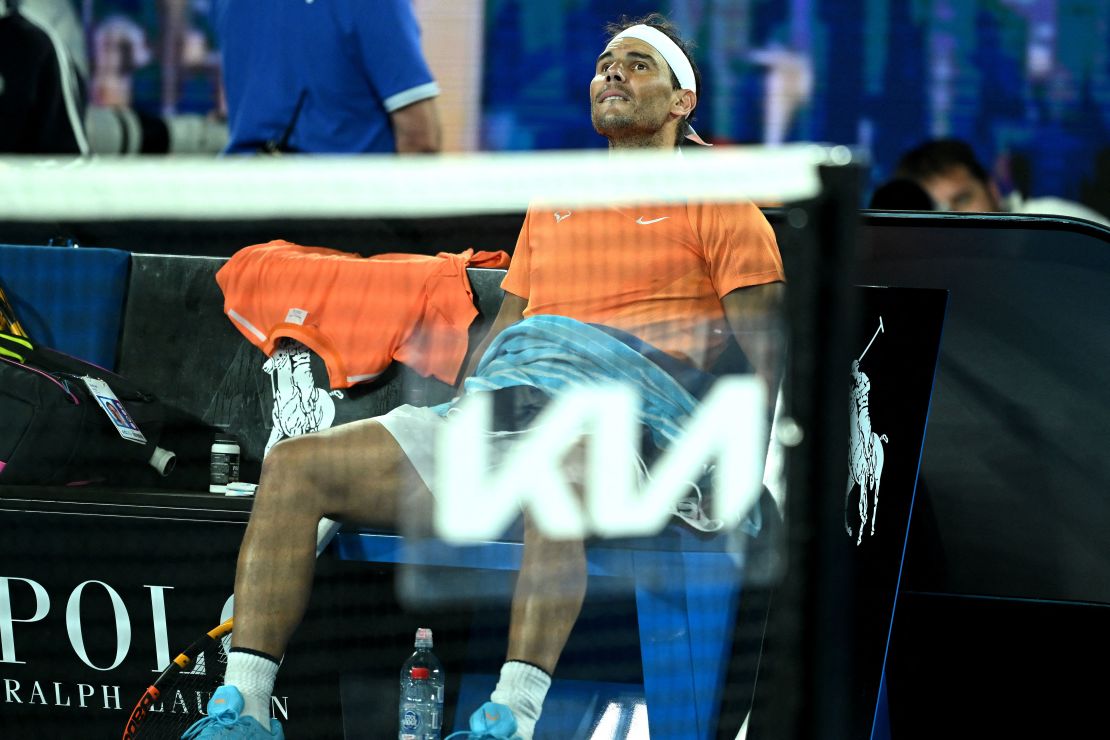 Spain's Rafael Nadal takes rest during the break in his men's singles match against  Mackenzie McDonald of the US on day three of the Australian Open tennis tournament in Melbourne on January 18, 2023. - -- IMAGE RESTRICTED TO EDITORIAL USE - STRICTLY NO COMMERCIAL USE -- (Photo by MANAN VATSYAYANA / AFP) / -- IMAGE RESTRICTED TO EDITORIAL USE - STRICTLY NO COMMERCIAL USE -- (Photo by MANAN VATSYAYANA/AFP via Getty Images)