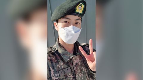 BTS member Jin shares a photo of himself in military uniform.