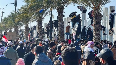 Soccer fans try to enter the Basra International Stadium to watch the final match of the 25th Arabian Gulf Cup between Iraq and Oman on January 19 in Basra, Iraq.