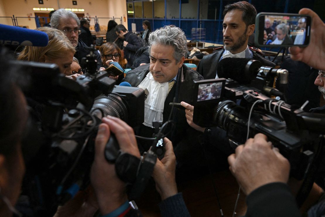 Italian prosecutor general Antonino Patti, center, speaks to the media in a special bunker court in Caltanissetta, Sicily, on January 19, 2023, where a trial hearing was held for Matteo Messina Denaro.