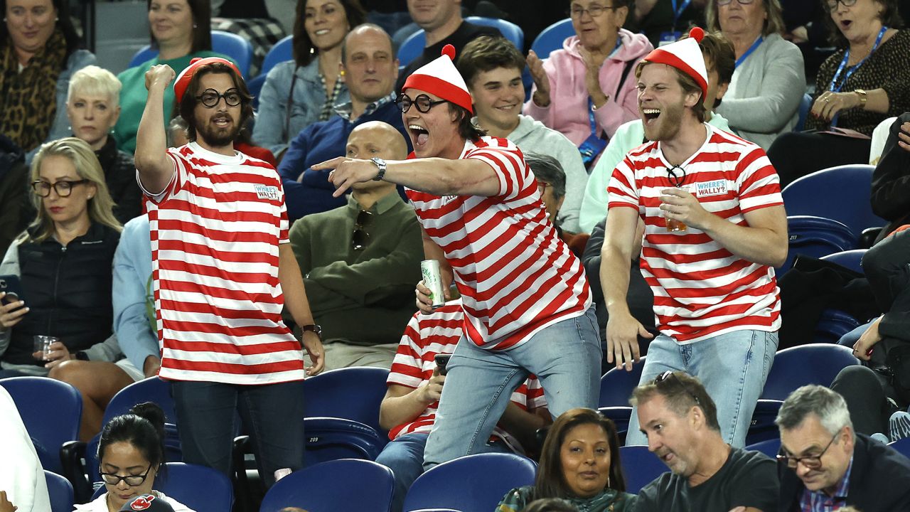 Fans in the crowd dressed up in 'Where's Waldo?' costumes are seen during the match between Djokovic and Couacaud.