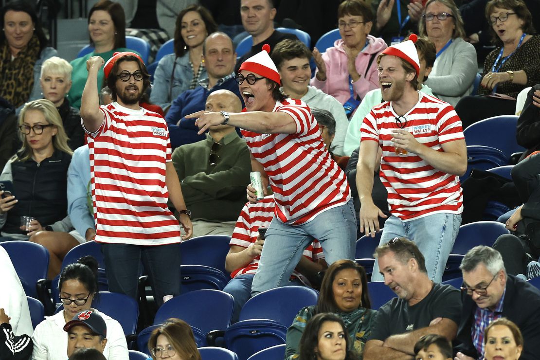 Fans in the crowd dressed up in 'Where's Waldo?' costumes are seen during the match between Djokovic and Couacaud.