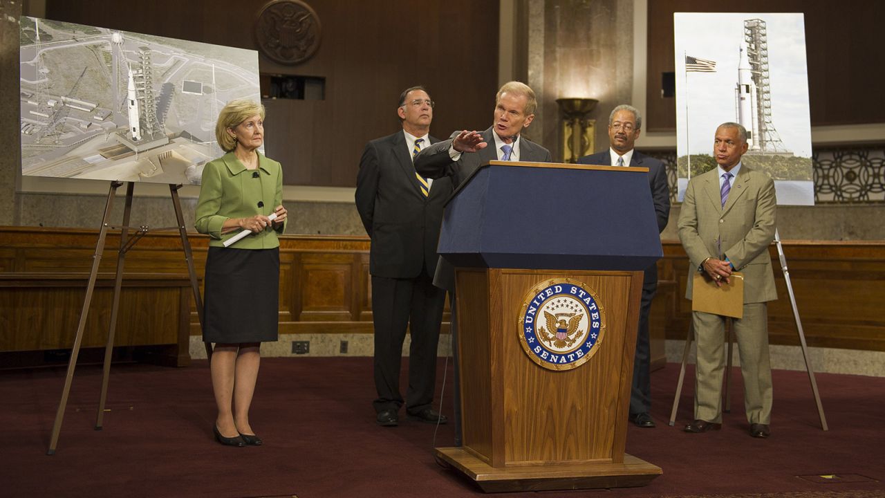 Members of Congress and NASA Administrator Charles Bolden unveil the Space Launch System design on September 14, 2011. From left: Sen. Kay Bailey Hutchison R-Texas, Sen. John Boozman, R-Ark., Sen. Bill Nelson, D-Fla., Rep. Chaka Fattah, D-Pa., Administrator Bolden.