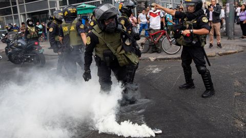 Police are pictured in the capital Lima on Wednesday.