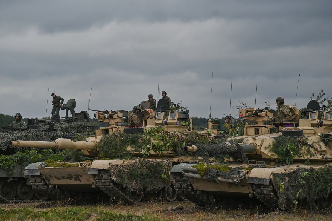 The M1 Abrams, a third-generation American main battle tanks, are seen at the end of the joint military exercises, at the training ground in Nowa Deba, on Sept. 21, 2022.