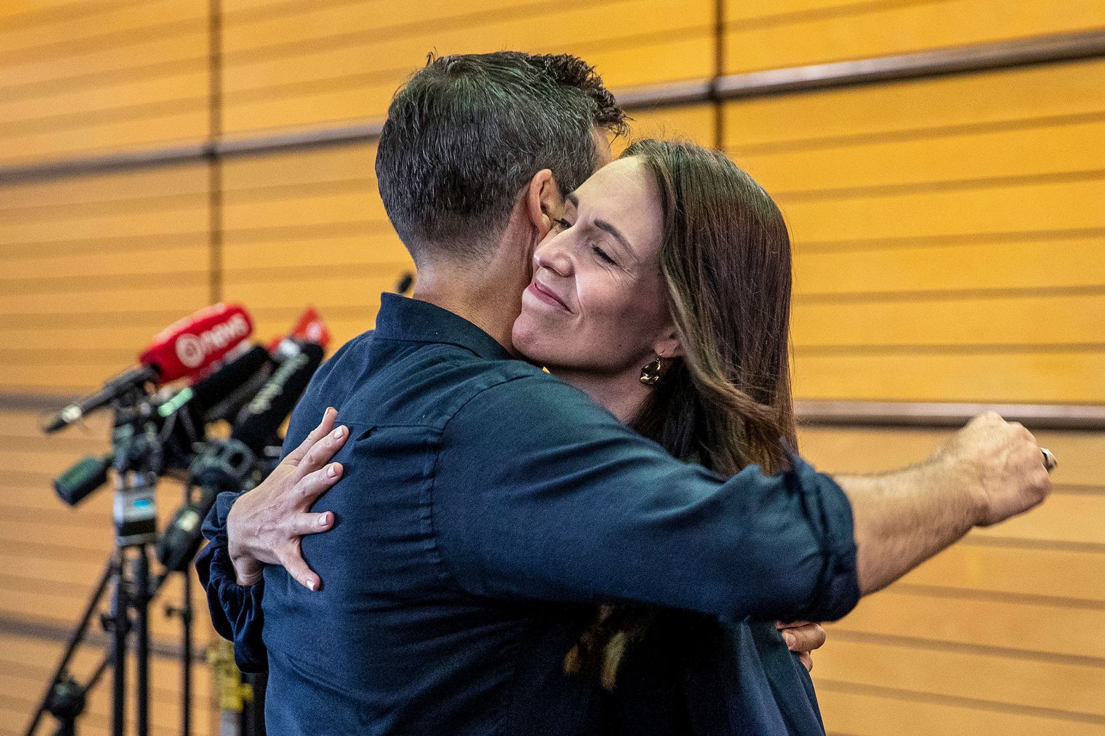 New Zealand Prime Minister Jacinda Ardern hugs her fiancée, Clark Gayford, after <a href="index.php?page=&url=https%3A%2F%2Fwww.cnn.com%2F2023%2F01%2F18%2Fasia%2Fnew-zealand-jacinda-ardern-not-seeking-reelection-intl-hnk%2Findex.html" target="_blank">announcing her resignation</a> at a news conference in Napier, New Zealand, on Thursday, January 19. Ardern told reporters that February 7 will be her last day in office, saying she doesn't believe she has the energy to seek re-election in October.