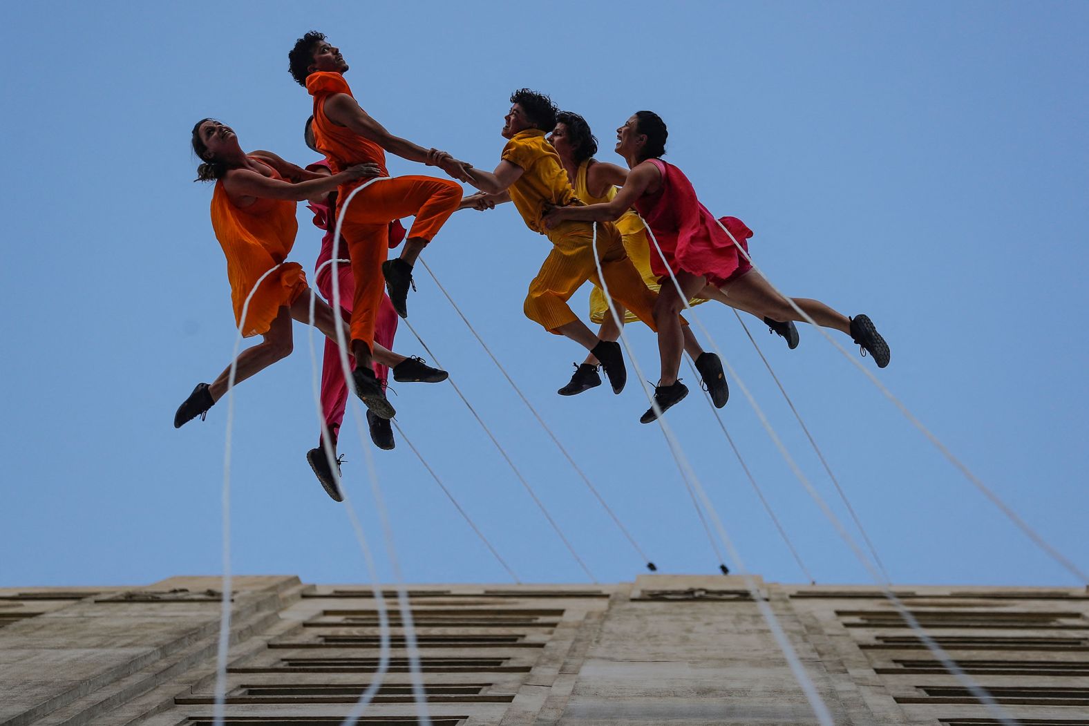 Dancers from the US company Bandaloop perform their show "Bird Sky" during the Teatro a Mil international performing arts festival in Santiago, Chile, on Friday, January 13.