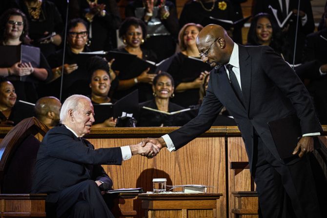 US Sen. Raphael Warnock, the pastor at Ebenezer Baptist Church, greets Biden during a worship service in Atlanta in January 2023. It was on the eve of Martin Luther King Jr. Day. King was co-pastor of the church from 1960 until his assassination in 1968. Biden became the first sitting president to deliver a Sunday sermon from the historic church.