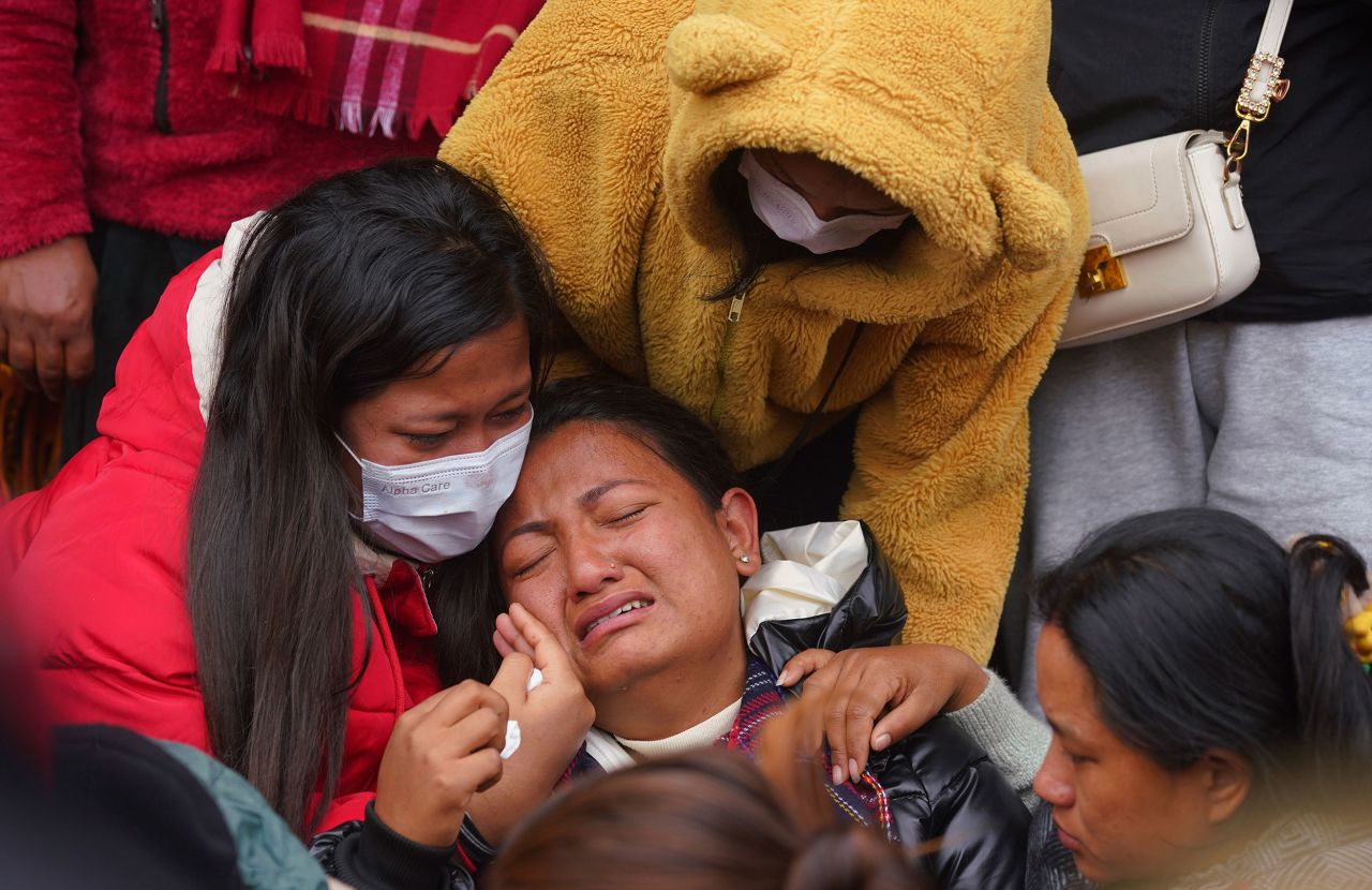 A woman cries as she waits in a hospital in Pokhara, Nepal, on Monday, January 16, to receive the body of a relative who died in the Yeti Airlines plane crash a day earlier.