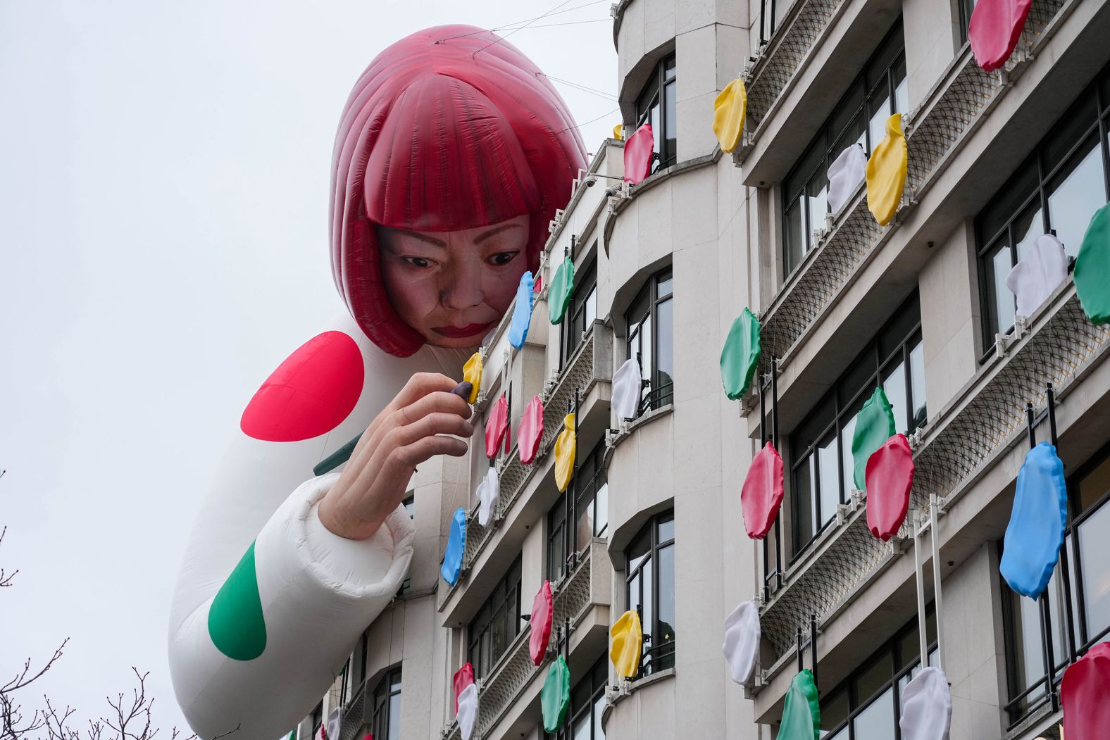 A sculpture by artist Yayoi Kusama is displayed on top of the Louis Vuitton store on the Champs-Élysées in Paris, France, on Thursday, January 12.<br />