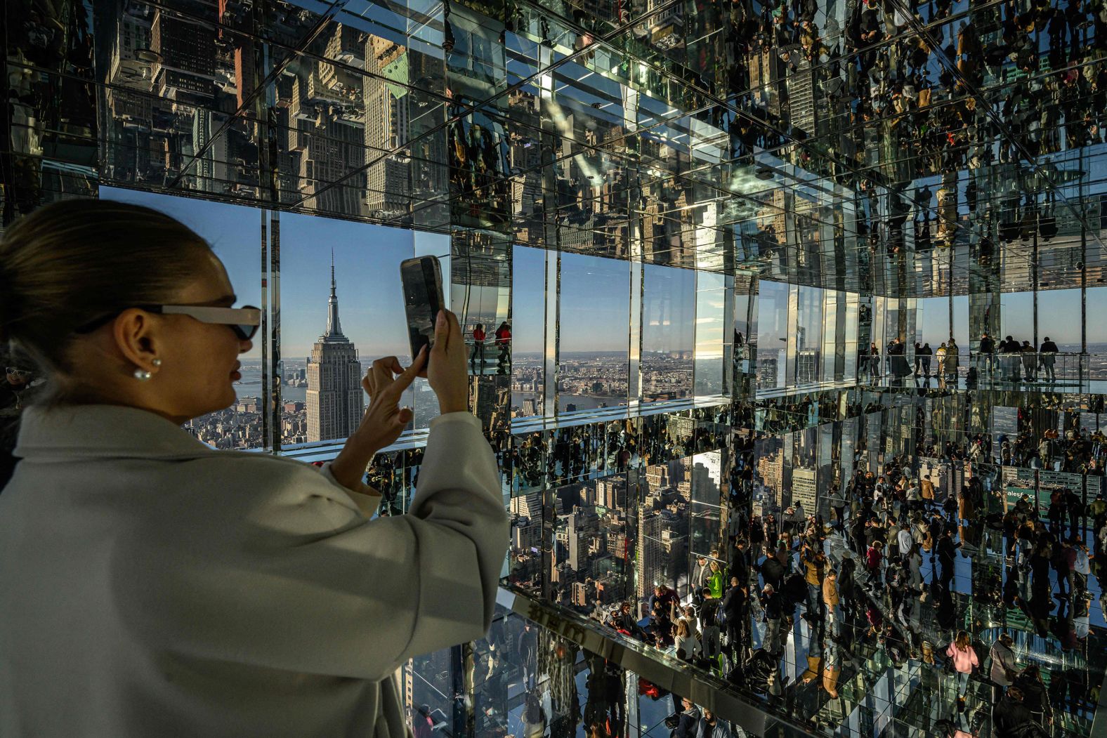 Visitors take photos at the viewing deck of One Vanderbilt in Manhattan on Monday, January 16.