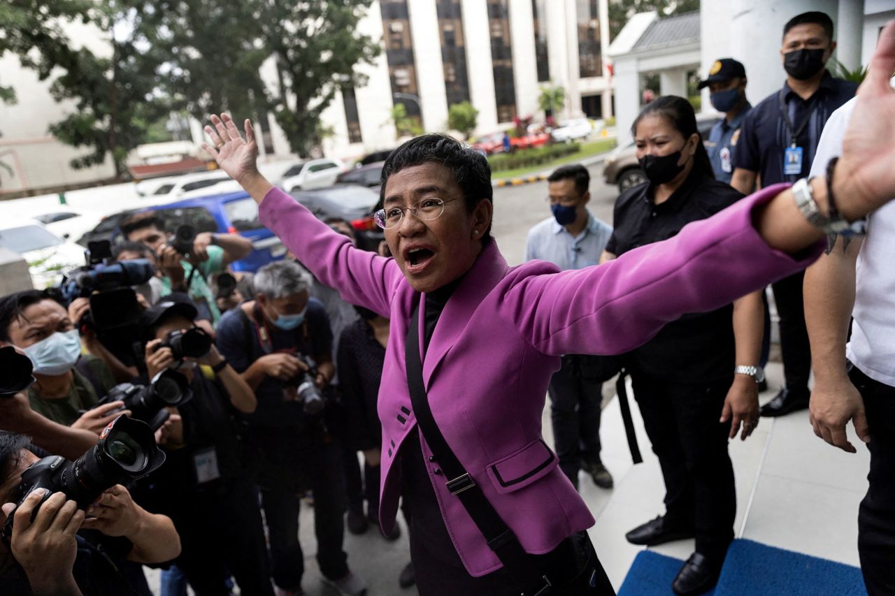 Nobel Laureate Maria Ressa gestures outside the Court of Tax Appeals on Wednesday, January 18, in Quezon City, Philippines, after being acquitted of four counts of tax violations filed in 2018 by former President Rodrigo Duterte's government. Ressa, the CEO and founder of news site Rappler and a former CNN bureau chief, told CNN after the verdict, 