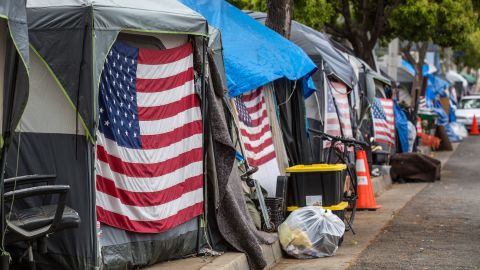 Homeless veterans are housed in 30 tents on the sidewalk on busy San Vicente Avenue outside the Los Angeles Veterans Administration campus on April 22, 2021.