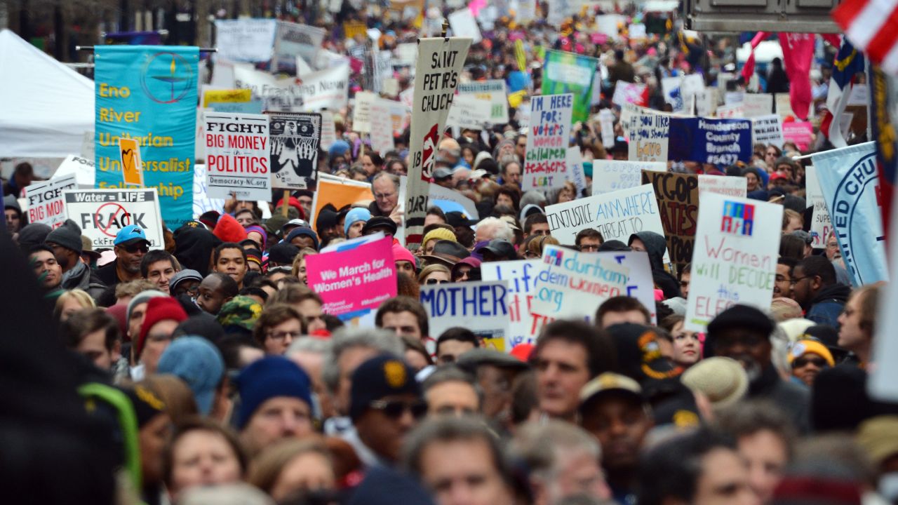 Thousands of people march through through downtown Raleigh, North Carolina, in what organizers describe as a "Mass Moral March" near the State Capitol building on February 8, 2014.  