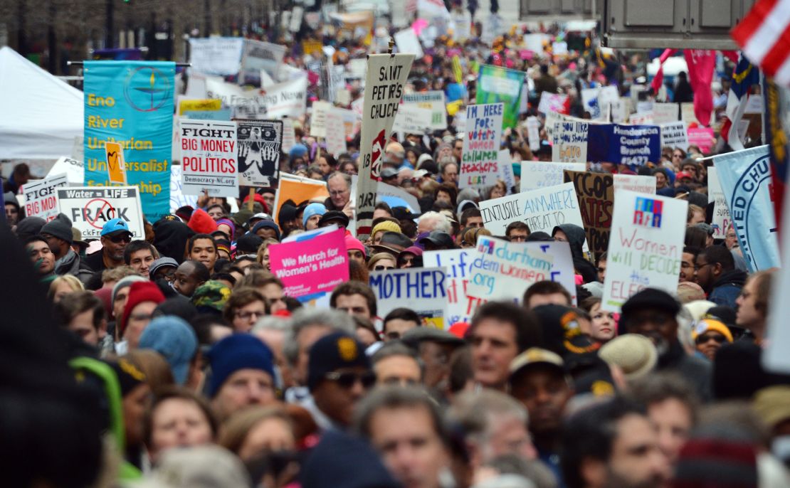 Thousands of people march through through downtown Raleigh, North Carolina, in what organizers describe as a "Mass Moral March" near the State Capitol building on February 8, 2014.  