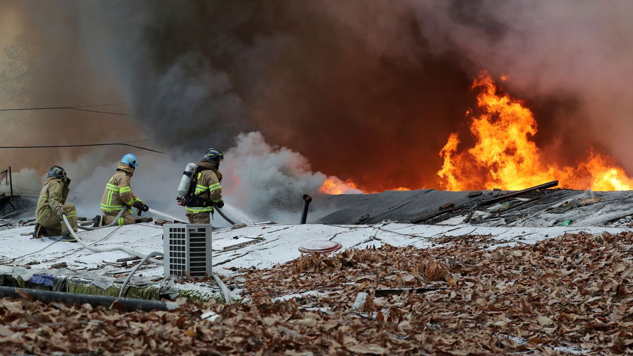 Firefighters battle a fire at Guryong village in Seoul, South Korea, on January 20.