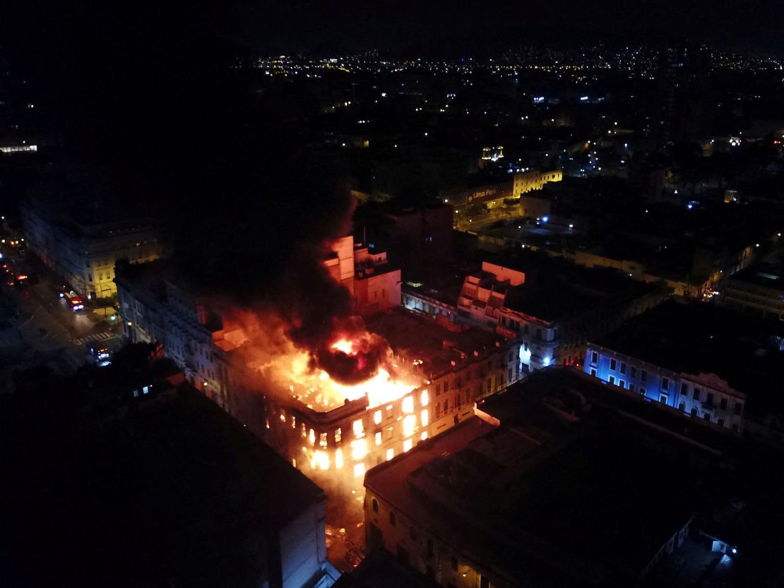 A historic building on fire during the 'Take over Lima' march.   