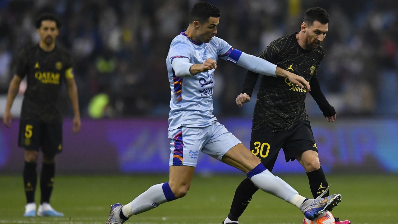 Lionel Messi and Cristiano Ronaldo fight for possession during the friendly match between Paris Saint-Germain and Riyadh XI at King Fahd International Stadium on January 19.