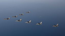 In this photo provided by South Korean Defense Ministry, four South Korean Air Force F-35 fighter jets, left top, and four US Air Force F-16 fighter jets fly over South Korea during a joint air drill in South Korea, Friday, Nov. 18, 2022.
