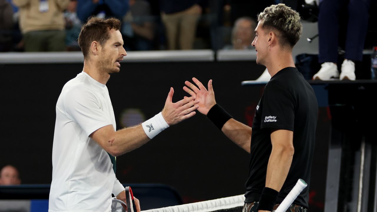 Murray (left) and Kokkinakis shake hands after their second-round match at the Australian Open. 