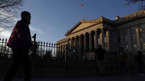 Joggers run past the Treasury Department on January 18, 2023, in Washington, DC.