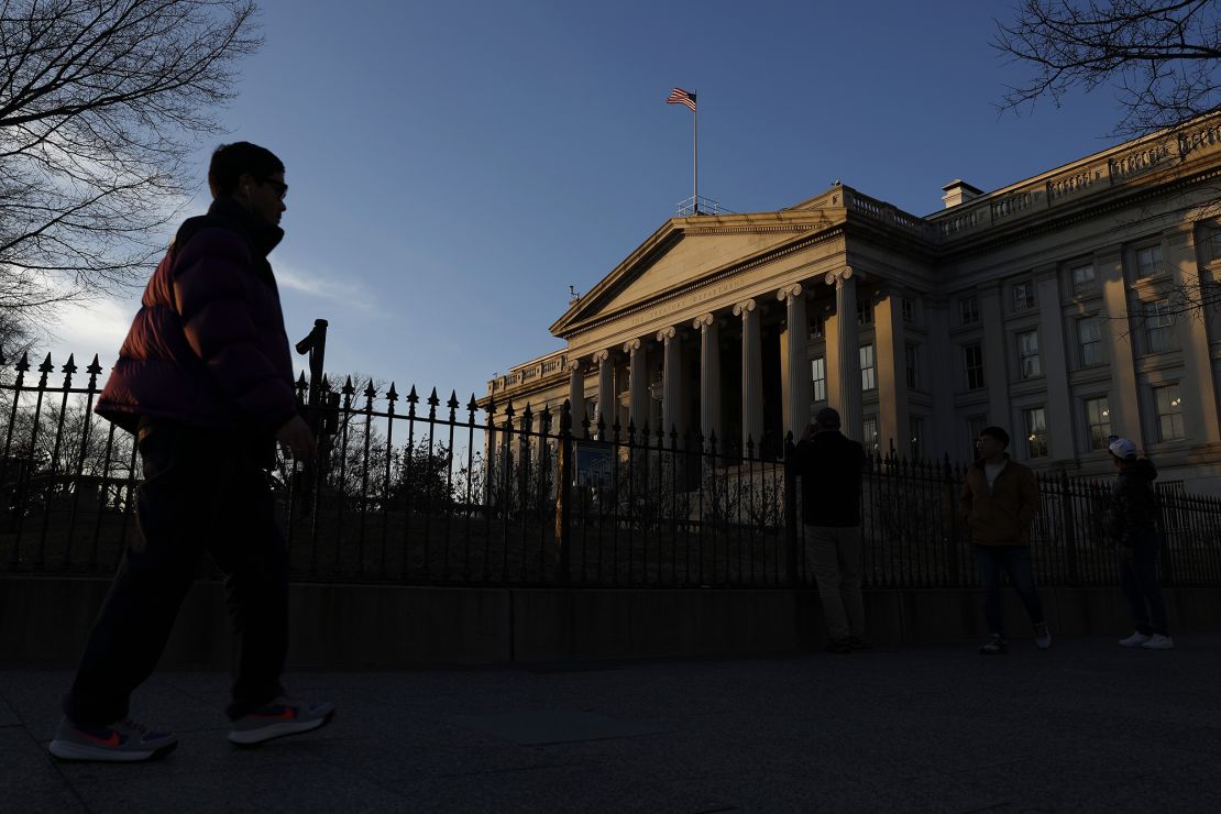 Joggers run past the Treasury Department on January 18, 2023, in Washington, DC.