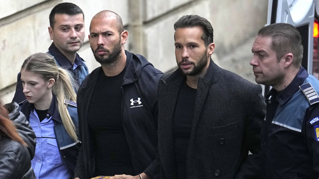 The Tate brothers are brought by police officers to the Court of Appeal in Bucharest on January 10.