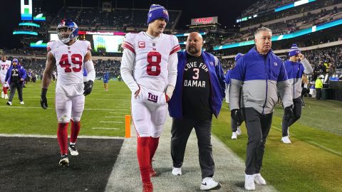 New York Giants' Daniel Jones and head coach Brian Dubboll leave the court on January 8, 2023.