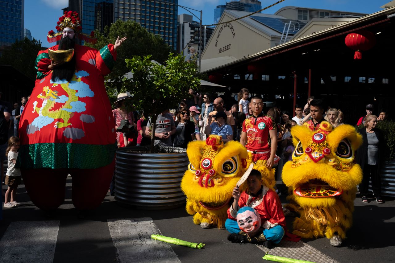 People gather around to watch members of the Vietnamese Buddhist Youth Association perform the dragon dance at Victoria Market on January 22, in Melbourne, Australia.