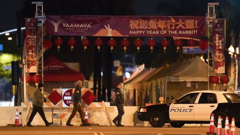 FBI agents walk near the scene of the massacre in Monterey Park, California.