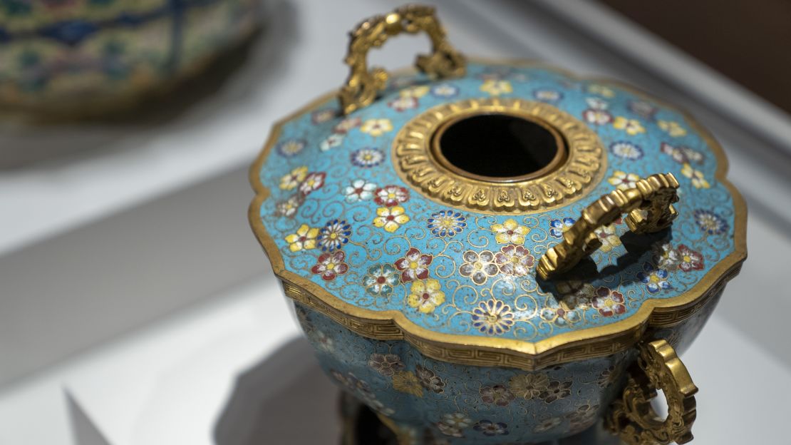 An extravagant hotpot used by the Qianlong emperor. While beautifully decorated using the cloisonné technique, its copper interior makes it entirely functional.