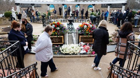 Mourners visit the grave of Lisa Marie Presley during her memorial on January 22, 2023 in Memphis, Tennessee.