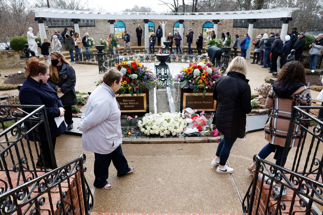 Mourners visit the grave of Lisa Marie Presley during her memorial on January 22, 2023 in Memphis, Tennessee.