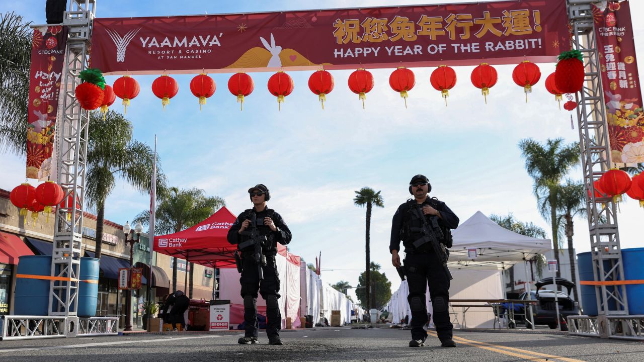 Police officers guard the area near the location of a shooting at a dance studio in Monterey Park, California, Sunday, January 22, 2023. 