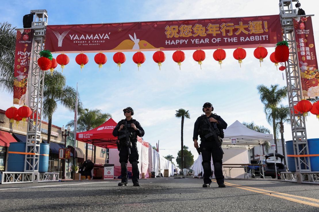 Police officers guard the area near the scene of the mass shooting in Monterey Park.