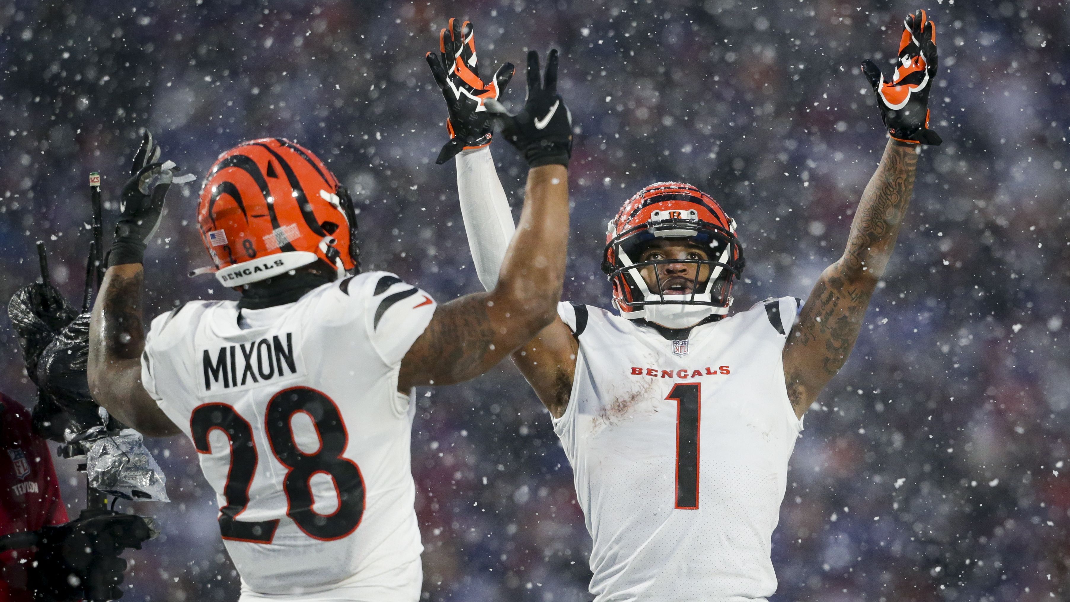 Cincinnati Bengals wide receiver Ja'Marr Chase and running back Joe Mixon motion for a touchdown against the Buffalo Bills during the third quarter. Both Chase and Mixon had TDs as the Bengals convincingly beat the Bills 27-10 to advance to the AFC Championship game. 